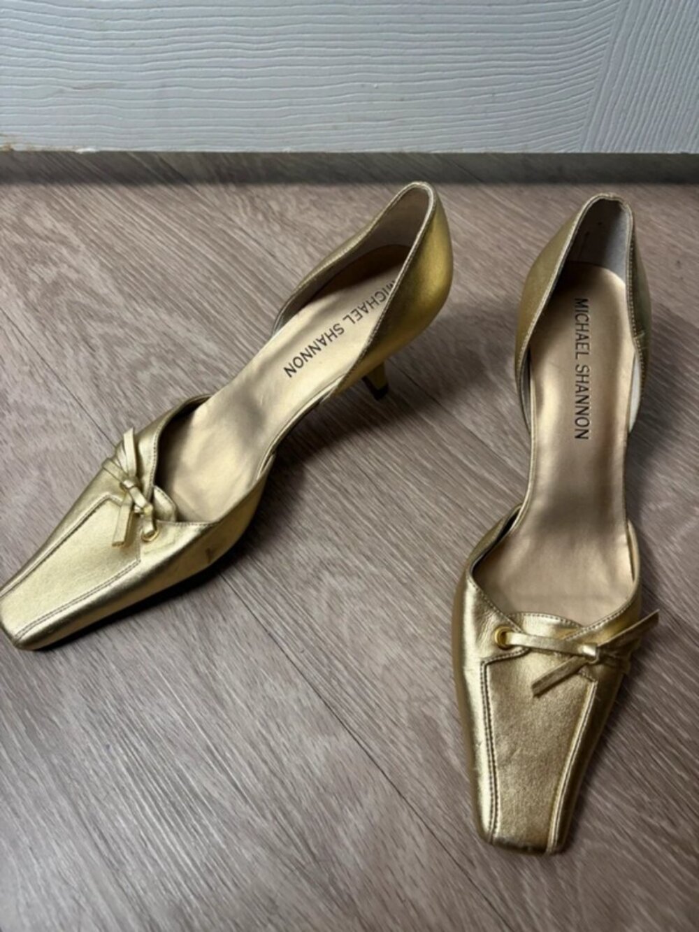 Gold kitten heels with bow detail